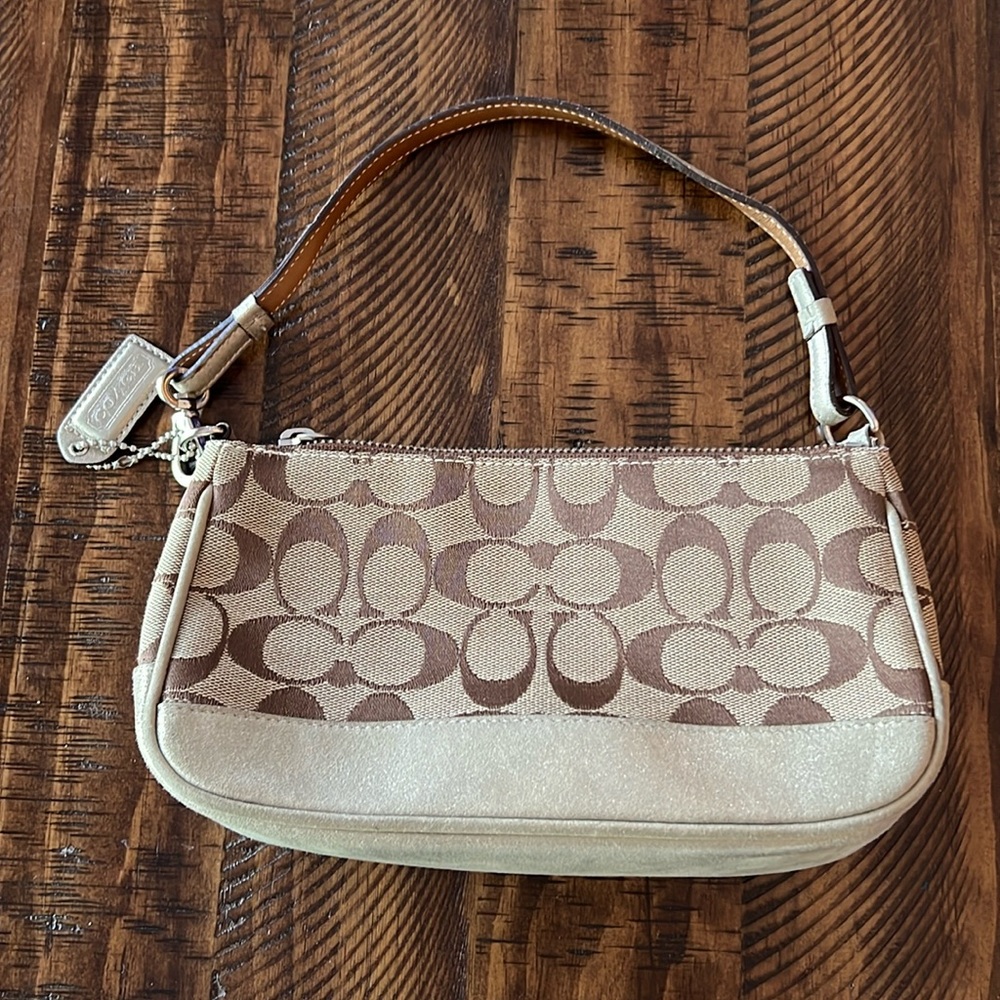 Coach handbag. 9x5x2. Handle drop 6 in. Excellent cond. Sig. coated canvas.